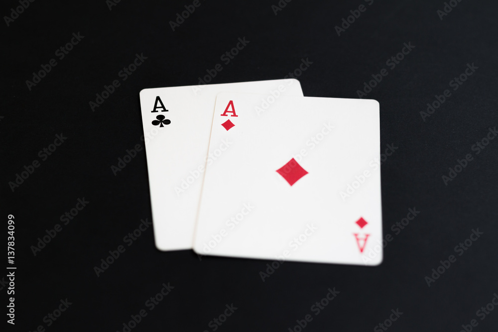 Playing poker cards aces on black background