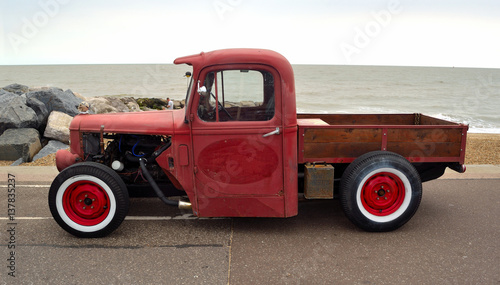  Classic Hot Rod  pickup truck on seafront promenade with sea in background