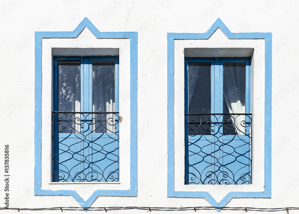 blue windows on a white wall blue windows on a white wall