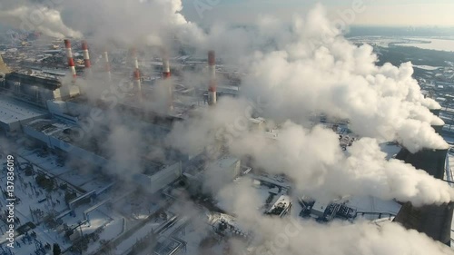 Air pollution concept. Power plant with smoke from chimneys. Drone shot. 4K. photo
