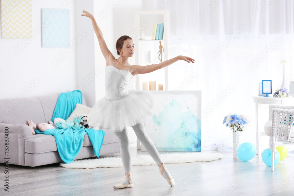 Young beautiful ballerina dancing in room Young beautiful ballerina dancing in room