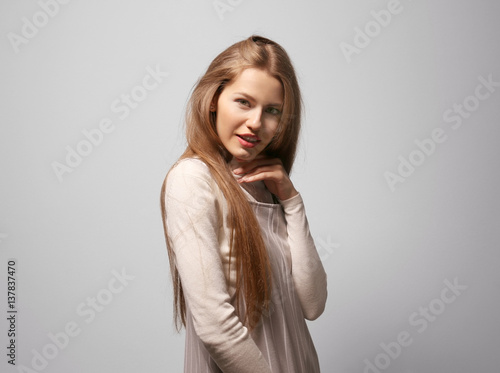 Beautiful young woman on color background