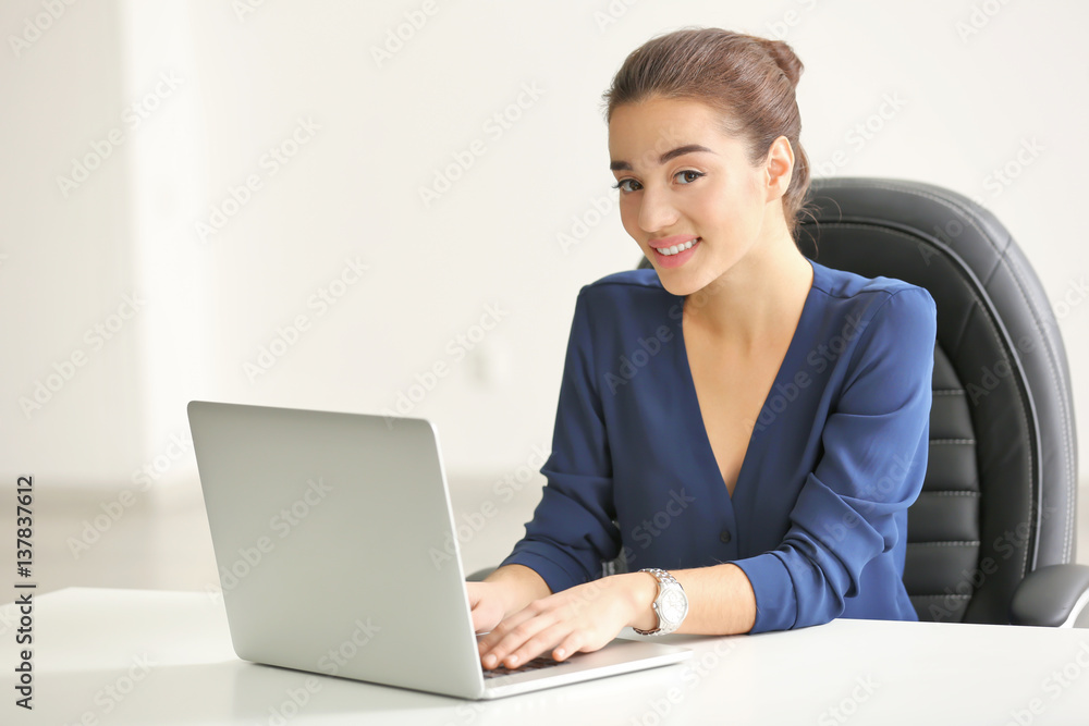 Beautiful young woman working in office Beautiful young woman working in office