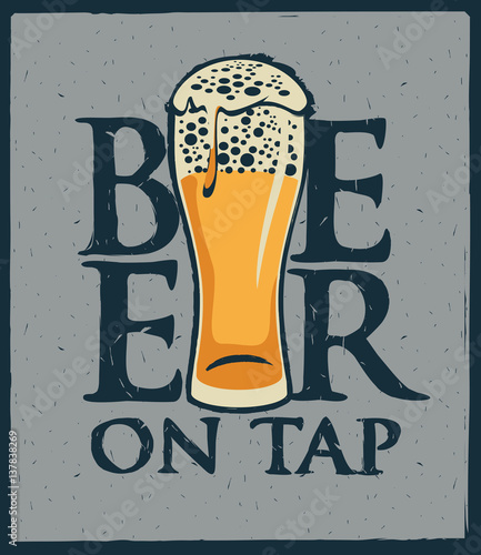 Glass of beer on tap with foam
