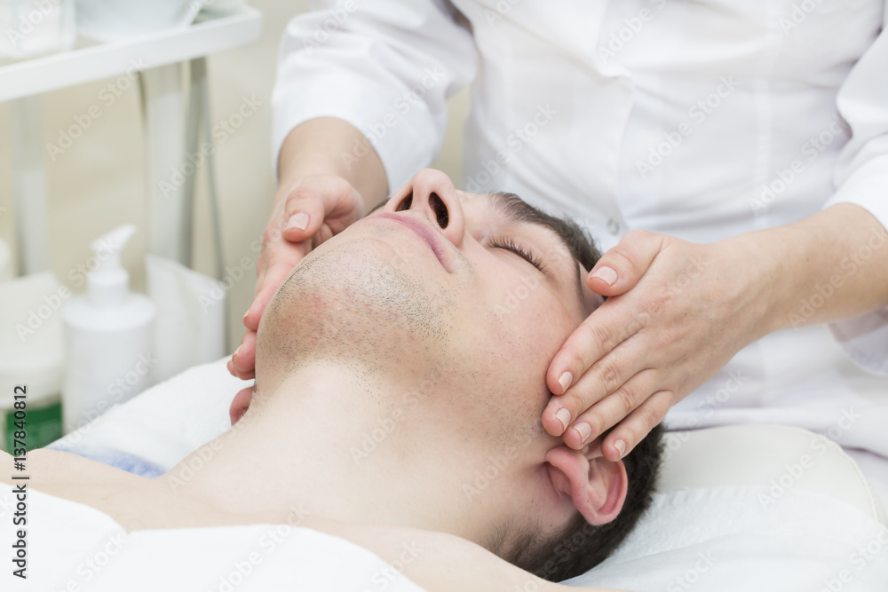 Man in the mask cosmetic procedure in spa salon Man in the mask cosmetic procedure in spa salon