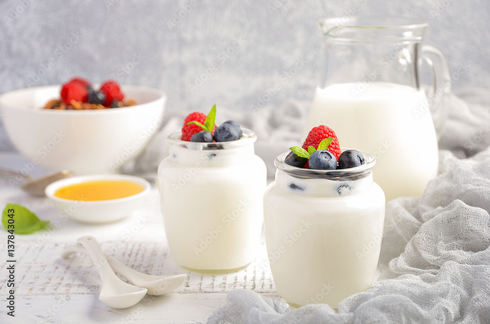 Homemade natural yogurt with blueberry and raspberry, selective focus Homemade natural yogurt with blueberry and raspberry, selective focus