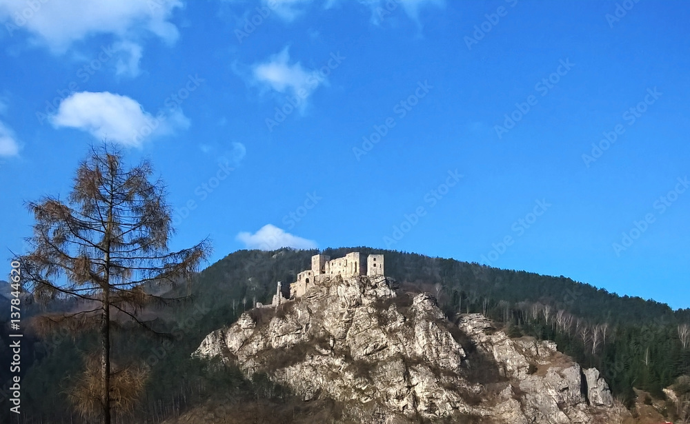 Castle on the rock in colorful woods during autumn. Slovakia Castle on the rock in colorful woods during autumn. Slovakia