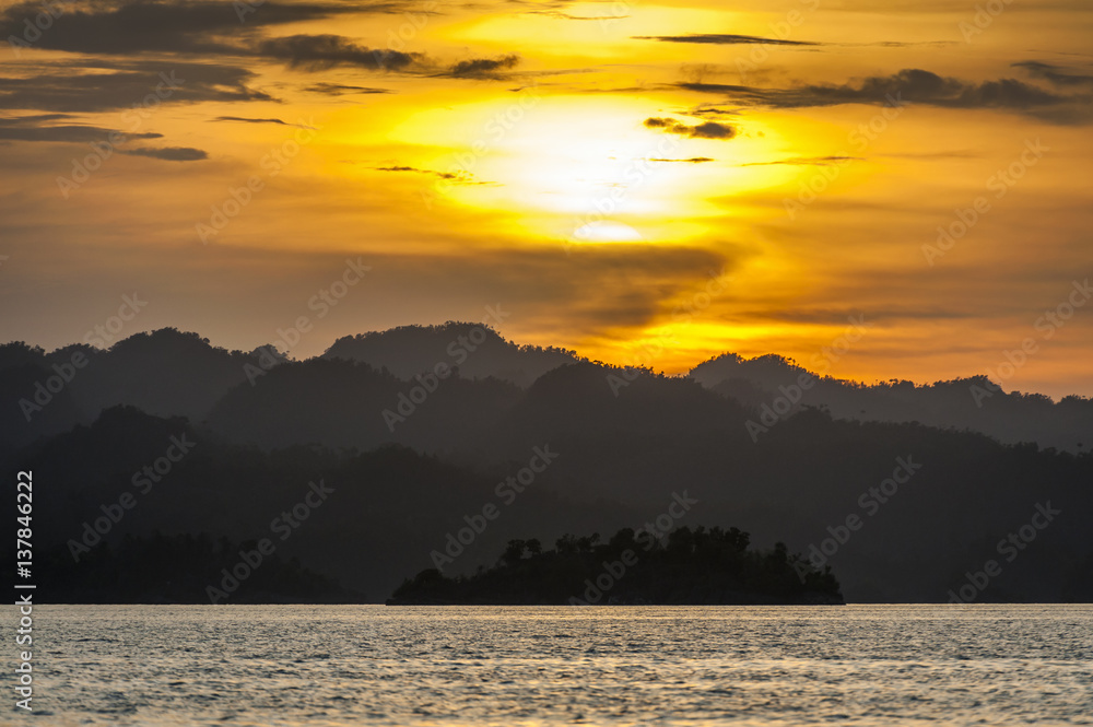 Sunset in the Raja Ampat Islands,Indonesia. Raja Ampat is an archipelago comprising over 1,500 small islands and is the part of Coral Triangle which contains the richest marine biodiversity on earth.
