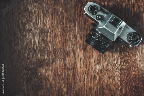 Wallpaper Mural Retro camera on wooden table Torontodigital.ca
