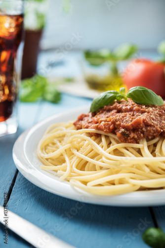 Traditional Italian spaghetti bolognese on wooden background