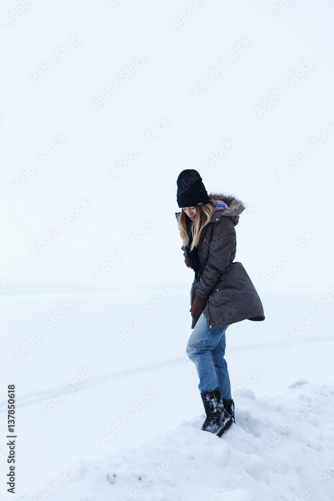 Girl on a background of a white field