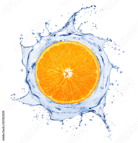 Orange is surrounded by a splash of water on white background
