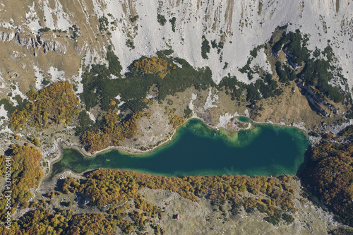 Aerial view of Skrcko Lake with a Katun (shepherd's summer hut) Durmitor NP, Montenegro, October 2008 photo