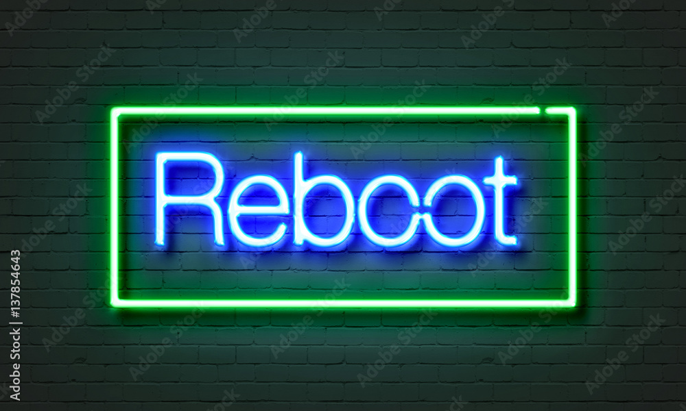 Obraz premium Reboot neon sign on brick wall background.
