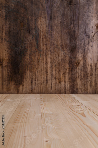 Old rustic wood background. Wooden board template for design. Rough dark plywood texture. Grungy pattern.