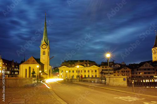 Wallpaper Mural Night photo of Fraumunster Church and bridge over Limmat River, city of Zurich, Switzerland Torontodigital.ca