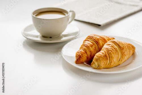 Business lunch with croissant on white table top view