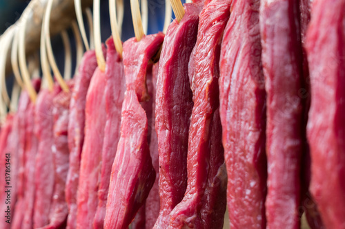 Wallpaper Mural Portion of beef jerky hang for drying with bamboo pegs Torontodigital.ca
