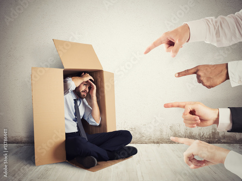 Fotografie Guilty businessman indicated by colleagues
