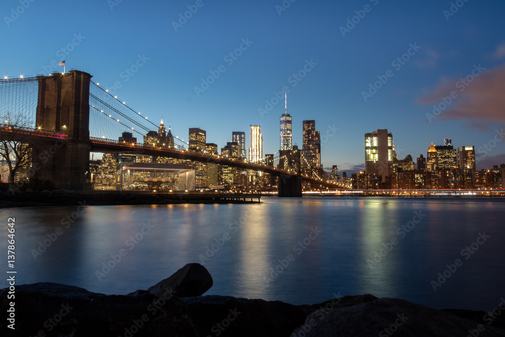 Brooklyn Bridge and Manhattan Skyline at sunset - New York, USA