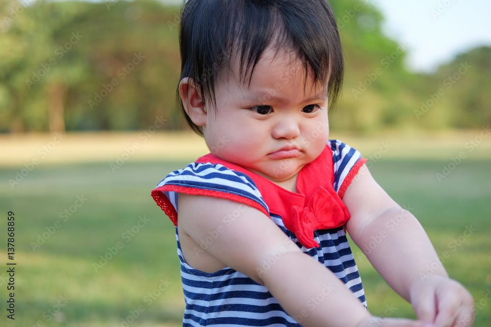Cute Baby girl playing in the garden, close-up portrait, Portrait of a beautiful baby girl Cute Baby girl playing in the garden, close-up portrait, Portrait of a beautiful baby girl