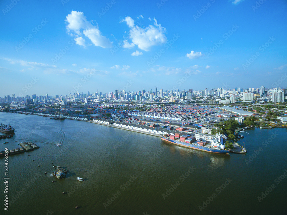 Naklejka premium Aerial view container and cargo ship, import export, business logistic supply chain transportation concept and crane at international Port for shipping cargo top view background