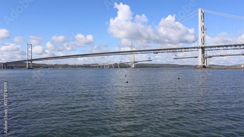 Timelapse of Forth Road Bridge and Queensferry crossing viewed from North Queensferry Scotland photo