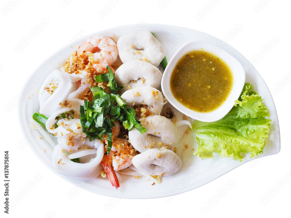 Boiled seafood dip with hot and sour sauce on white plate isolated . Boiled seafood dip with hot and sour sauce on white plate isolated .