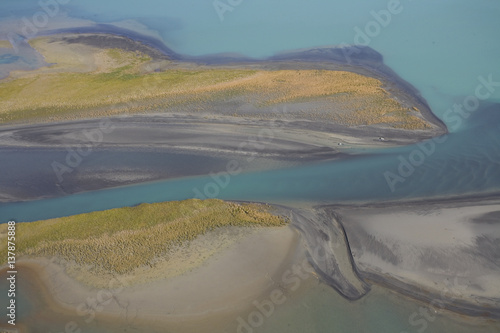 Aerial view over Lake Laitaure showing silt deposits from the Rapa river forming sand spits and vegetational growth, Sarek National Park, Laponia World Heritage Site, Lapland, Sweden, September 2008 photo