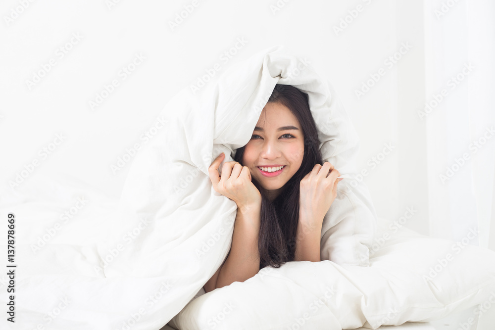 Young asian girl chilling on bed