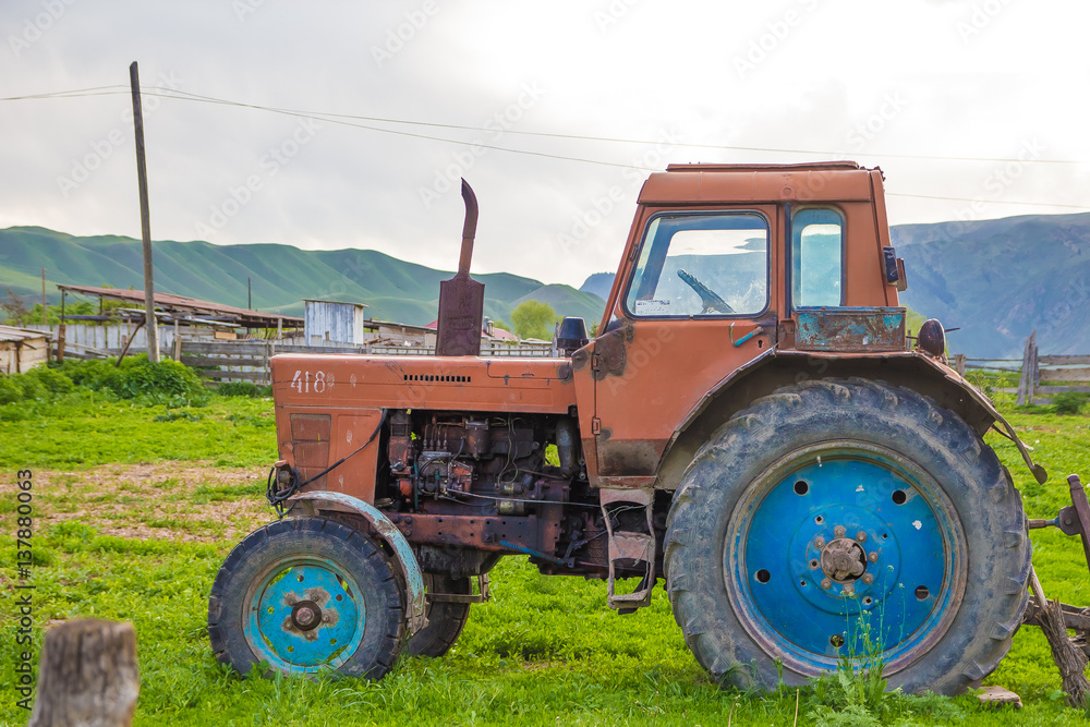 Very old rusted tractor parked in nature Very old rusted tractor parked in nature