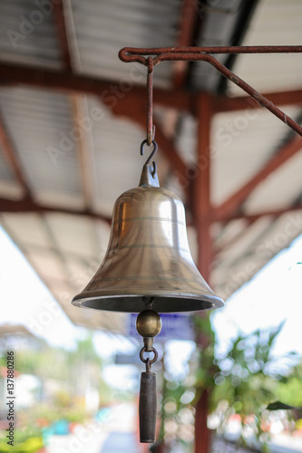 Shiny bell used to signal the train station