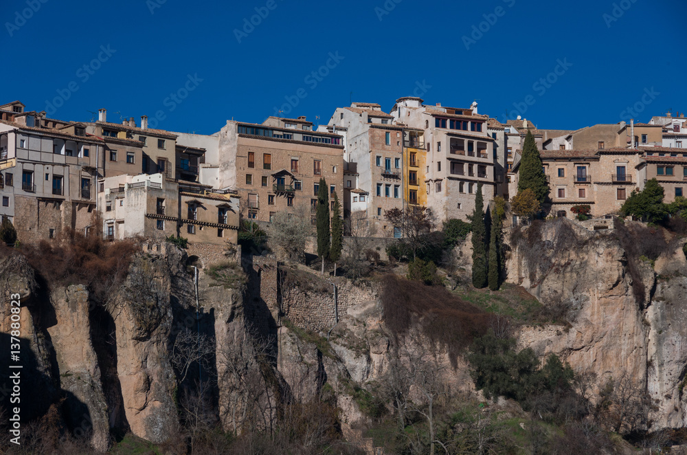 View to hanging houses of Cuenca old town.  Example of a medieval city, built on the steep sides of a mountain. Many houses are built right up to the cliff edge. Cuenca, Spain