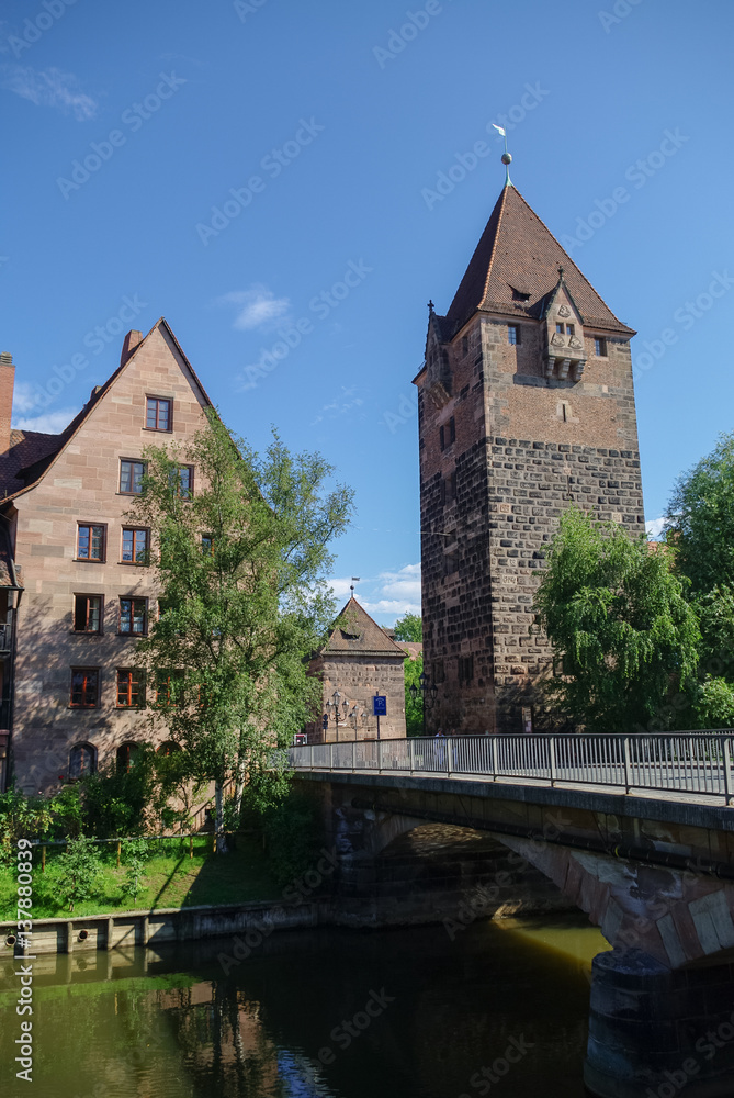 Old Tower Schuldturm and Heubrucke  bridge across  Pegnitz river in Nuremberg old town, Bavaria. Germany