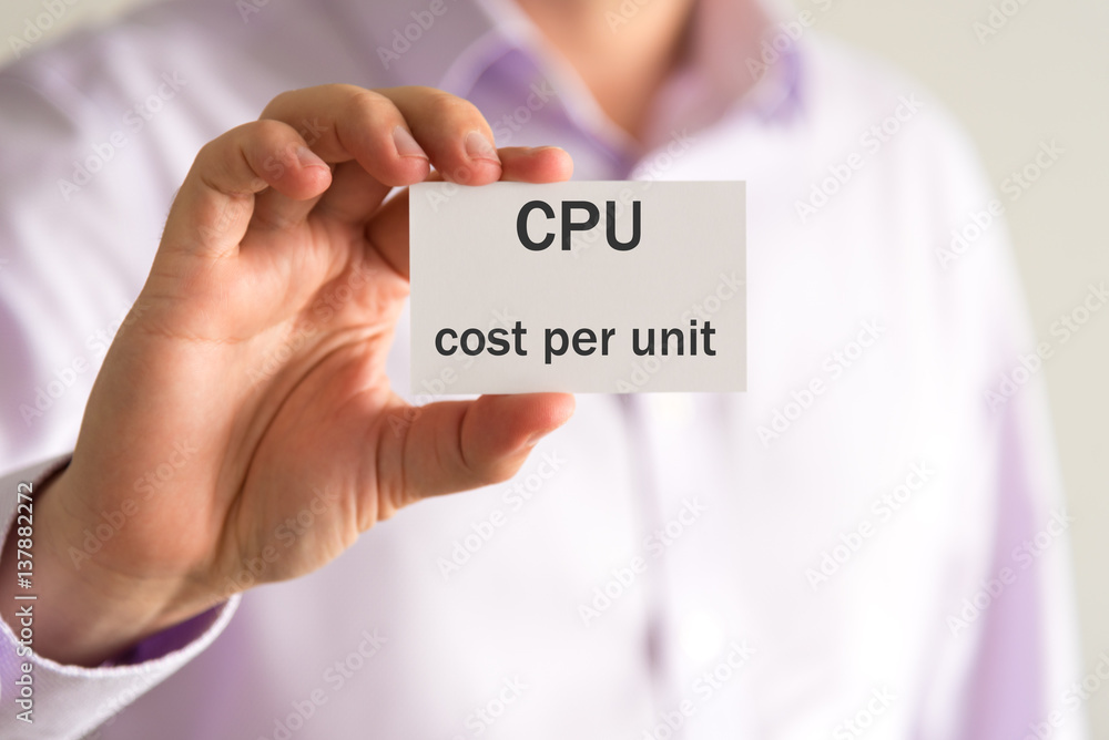 Businessman holding a card with text CPU COST PER UNIT Businessman holding a card with text CPU COST PER UNIT