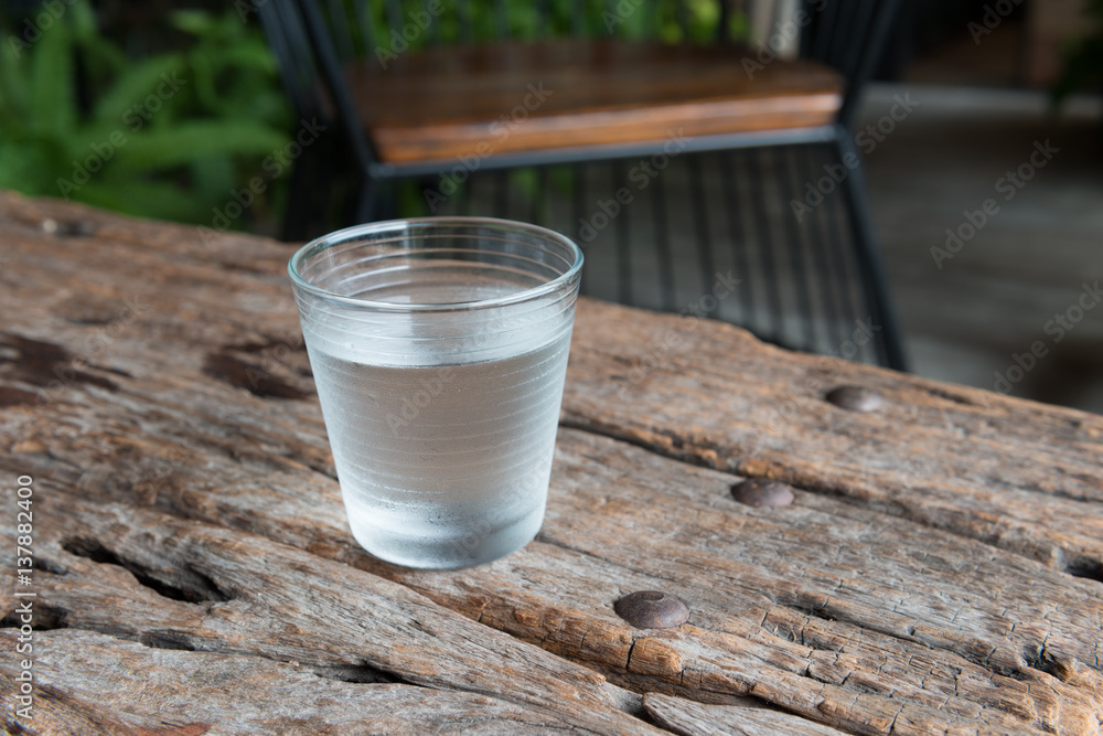 glass of water on a table glass of water on a table