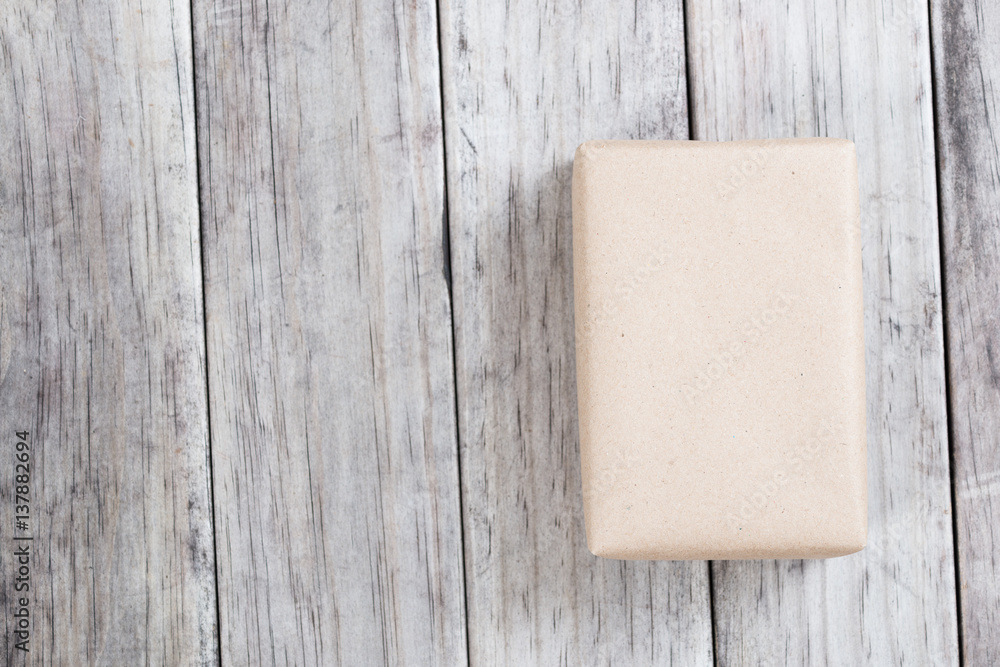 Cardboard box on a wooden background, Brown mail package parcel wrap delivery Cardboard box on a wooden background, Brown mail package parcel wrap delivery