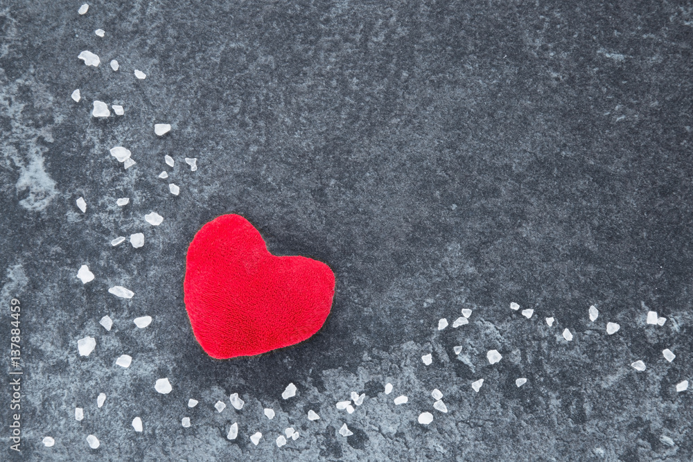 Obraz premium Red heart with small, white crystal stones on the dark background. Valentine's Day.