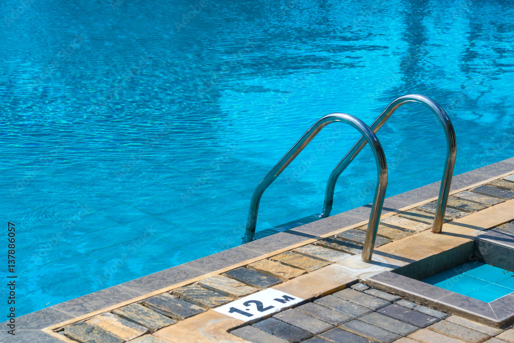 Hotel swimming pool with sunny reflections Hotel swimming pool with sunny reflections