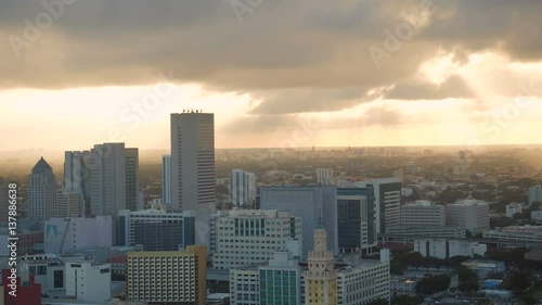 Miami Aerial v22 Flying low over downtown panning with cityscape views at sunset. photo