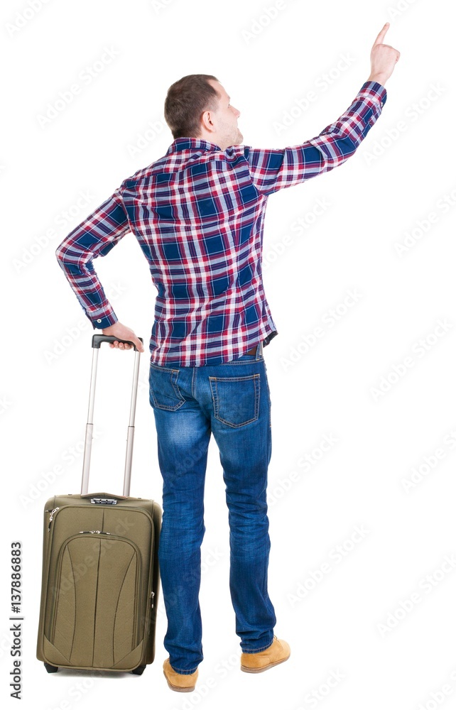 back view of pointing man with suitcase. back view of pointing man with suitcase.
