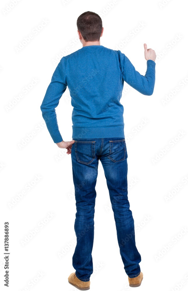 Back view of man in blue pullover shows thumbs up. Back view of man in blue pullover shows thumbs up.