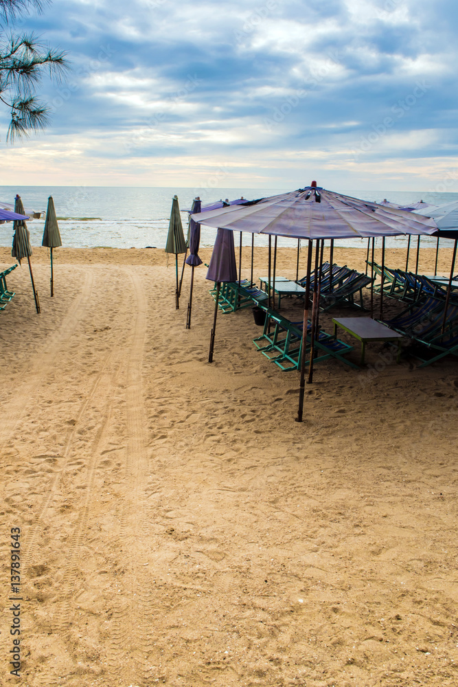 Canvas daybed under the beach umbrella