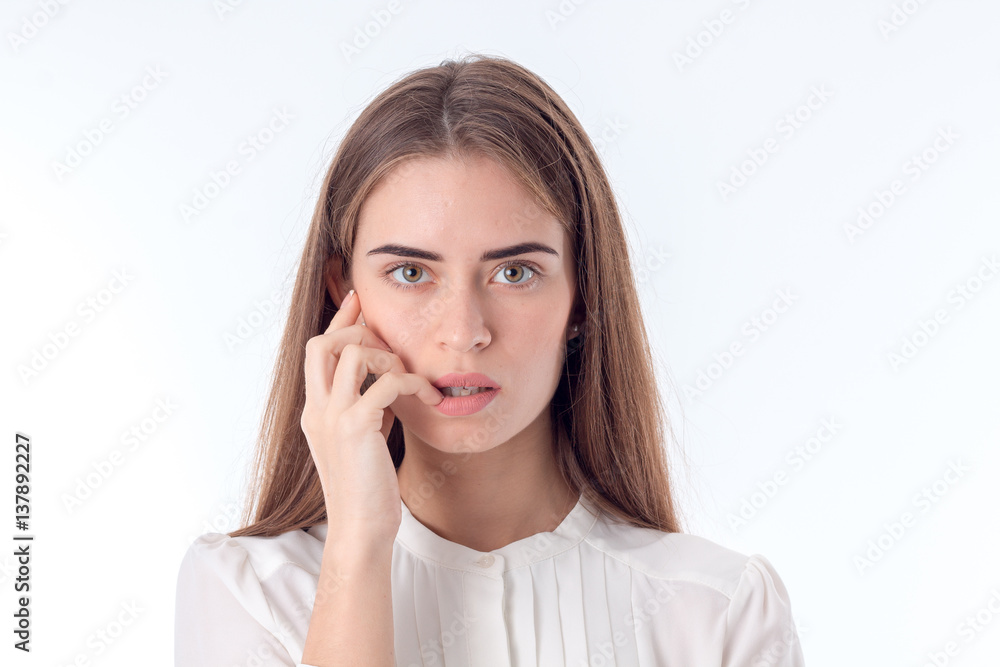 young girl looks right and keeping his hand near the face isolated on white background young girl looks right and keeping his hand near the face isolated on white background