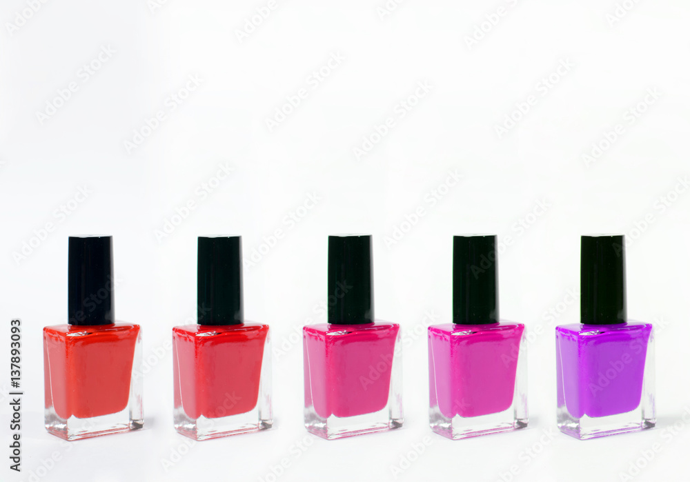 Group of bright nail polishes isolated on white Group of bright nail polishes isolated on white