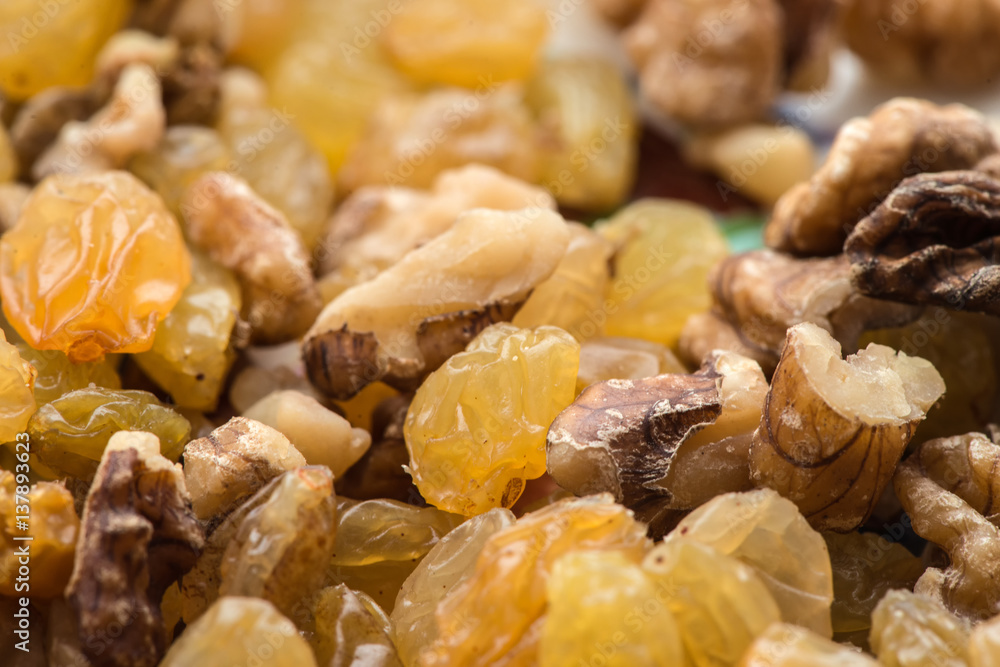 raisins and walnuts closeup background raisins and walnuts closeup background