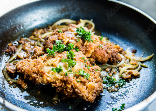 Photography frying  chicken milanese in pan