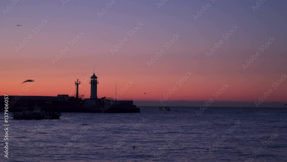Fishing boats at sunrise swim out in the open sea. Fishing boats at sunrise swim out in the open sea.