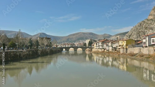 Old Ottoman houses evening panoramic view by the Yesilirmak River in Amasya City photo