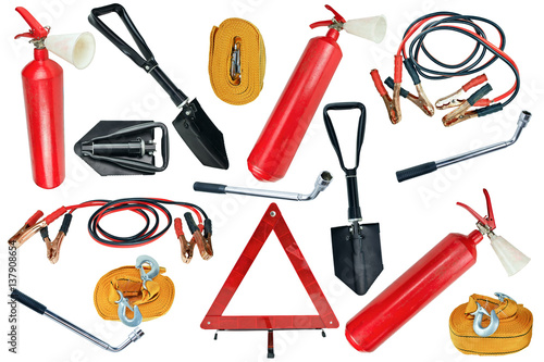 Elements of the essentials for a passenger car. Danger Safety Warning Triangle Sign, towing rope, fire extinguisher, Jumper cable, wheel wrench and shovel. photo